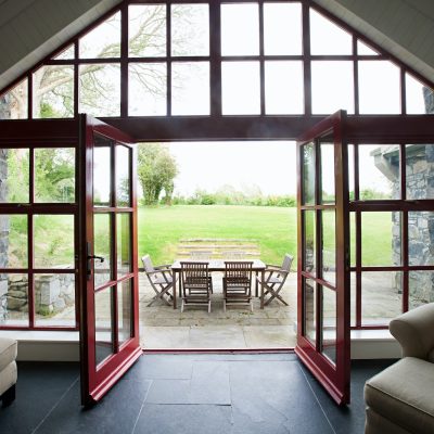 Room with doors open onto patio